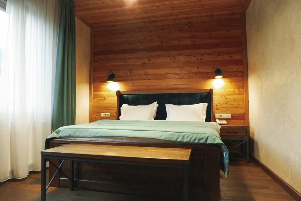 Double bed in apartments of cozy hotel