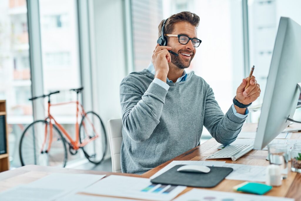 Shot of a young call centre agent working in an office